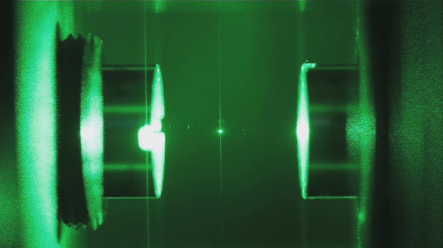 Glass nanoparticle suspended in optical cavity